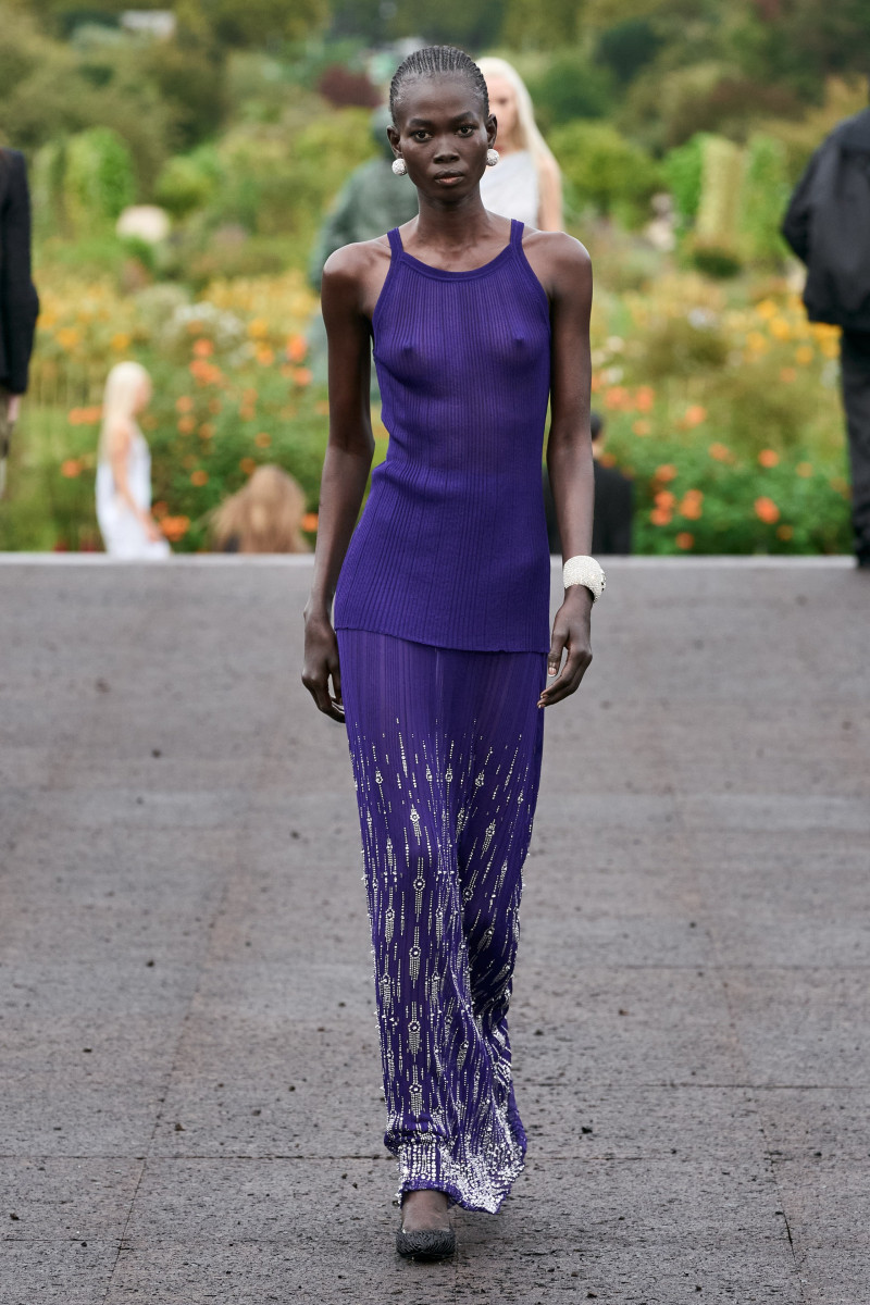 model in purple maxi skirt
