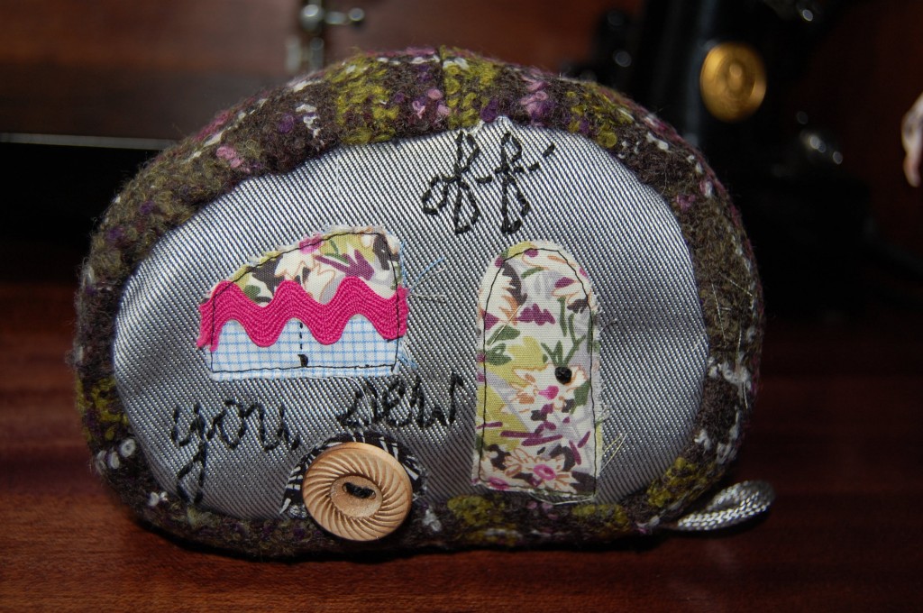 Stuff your pincushion with the fiberfil, the more compact the better as you may even want to insert a piece of card stock at the top to bring stability to the pins. Close seam with a ladder stitch.