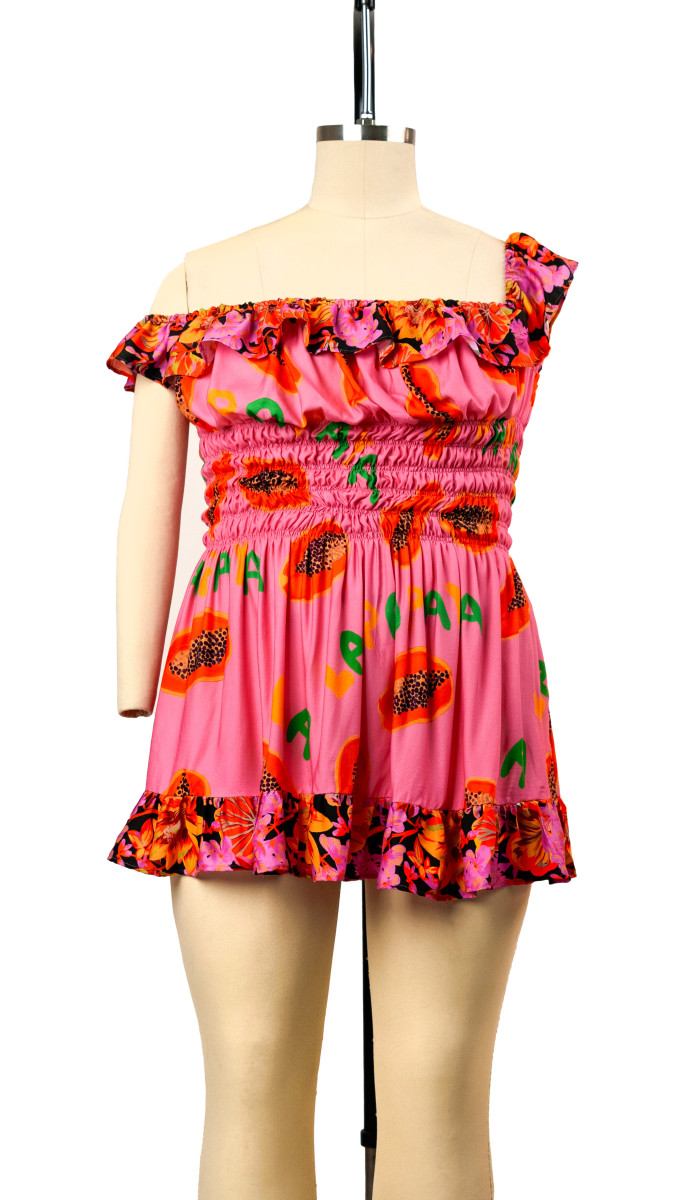 Red floral Sheered Dress on a dress form.