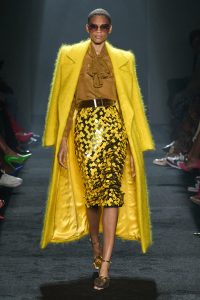 model wearing a yellow trench coat