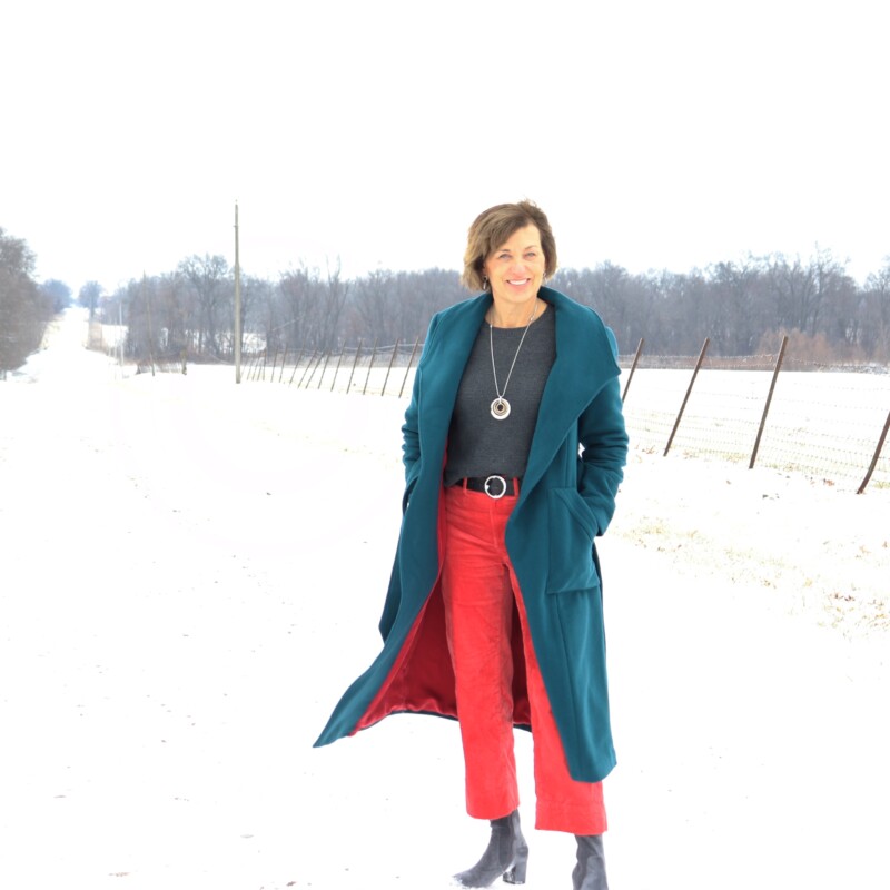 woman wearing blue wool coat