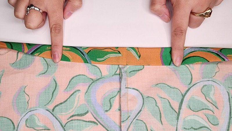 Fold over the casing to just slightly wider than your elastic