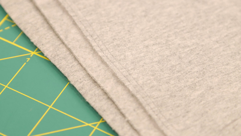 How To Finish The Edges of The Fabric with Top Stitching For The Bivalvia Beach Romper In Stretch Cotton Fashion Fabric