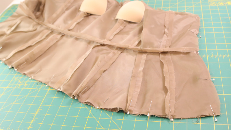 How To Sew The Main Fabric and The Lining Together Around The Bottom Edge And The Sides Over The Zipper For The Ela Peplum Top In Striped Suiting and Bemberg Lining Fashion Fabrics