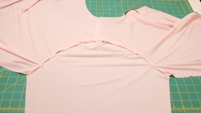Join the sleeves to the shirt by sewing the sleeve cap around the shoulder seam.