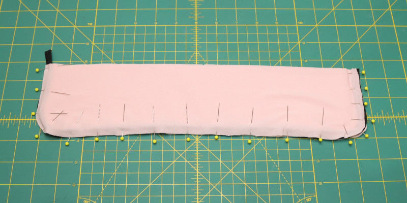 Pin and sew the collar pieces with piping in between.