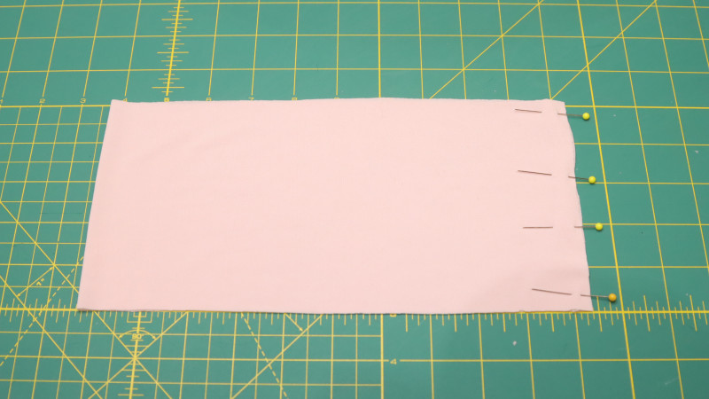 Sew the seam to close the pant cuffs, then fold at the fold line.