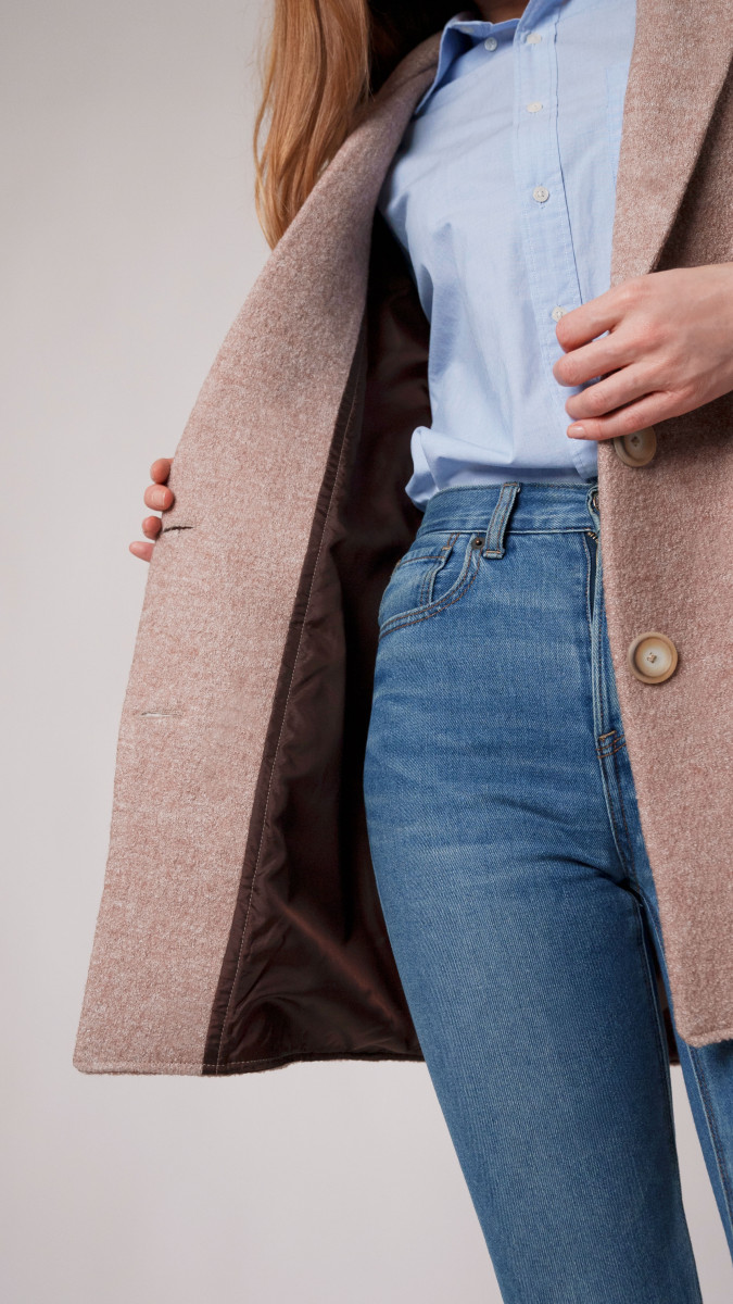 Ketil Boiled Wool Coating from Mood Fabrics sewn into the Bergen Coat, close-up of model showing interior brown lining with light blue shirt and jeans.