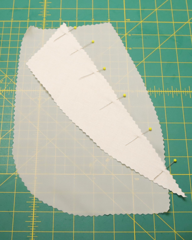 Flip the facing over and pin with the notches aligned.