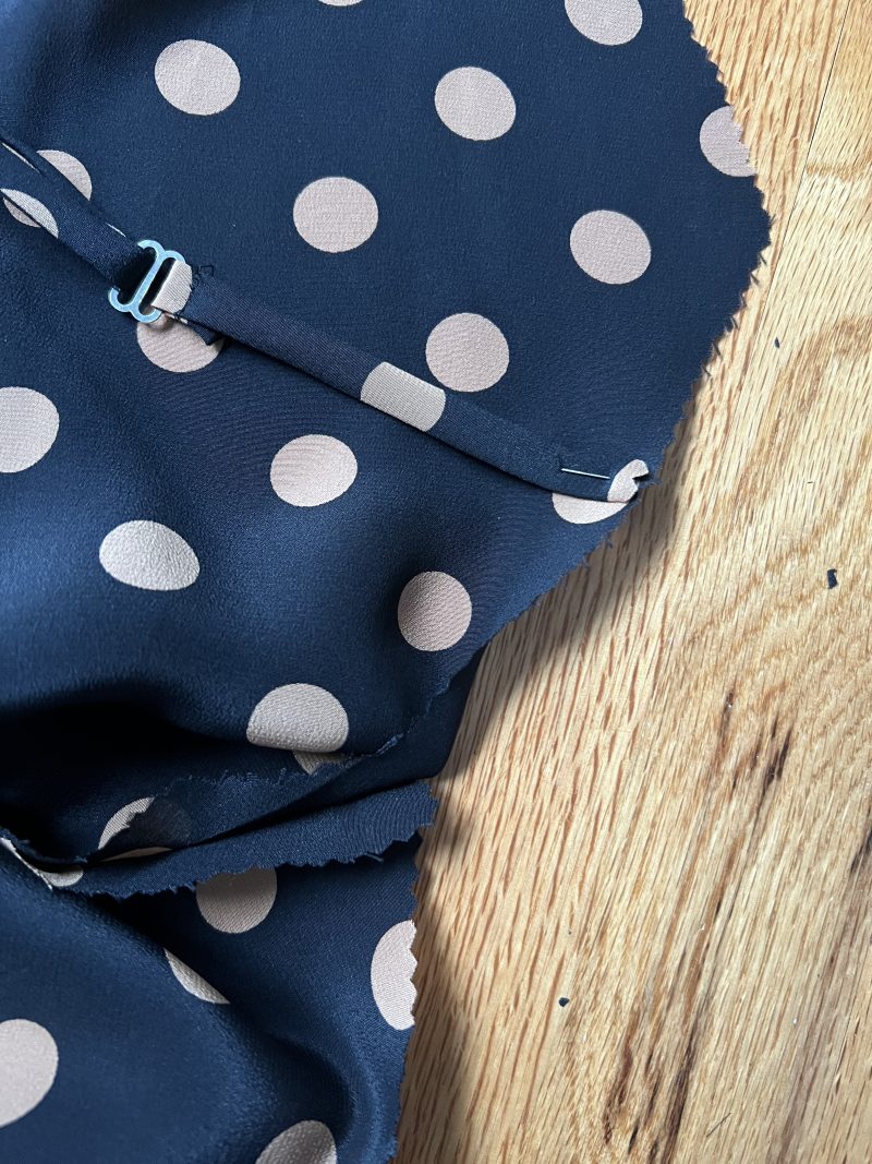 How to pin the adjustable straps to the front of the dress