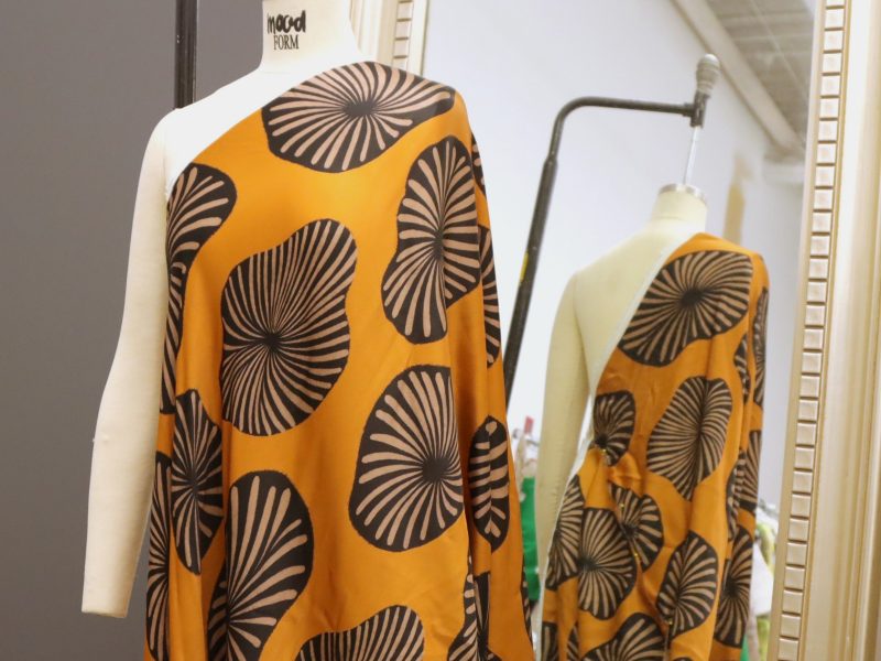 How to drape the fabric over the left shoulder of the dress form