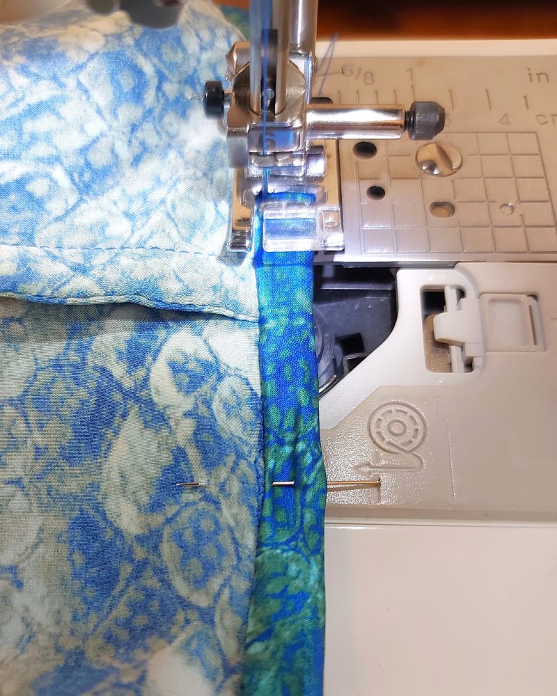 How to finish sewing the binding to the armhole