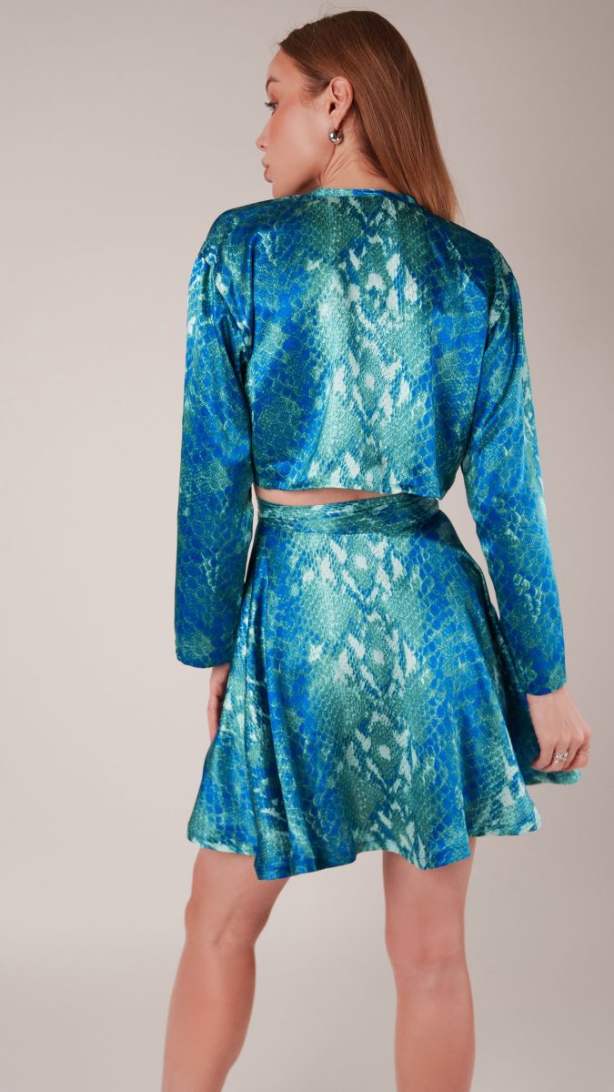 Back view of model wearing matching ensemble set made from blue and green python printed silk charmeuse fashion fabric