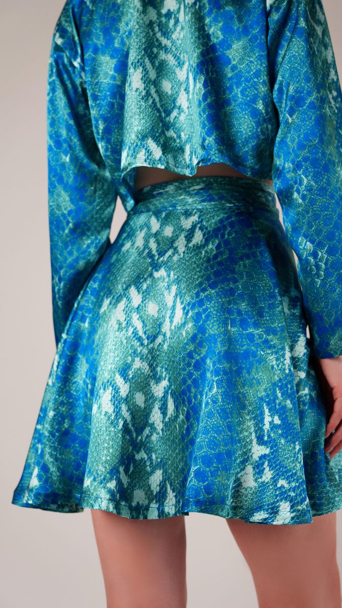 Back view of model wearing wrap skirt made from python printed silk charmeuse fashion fabric