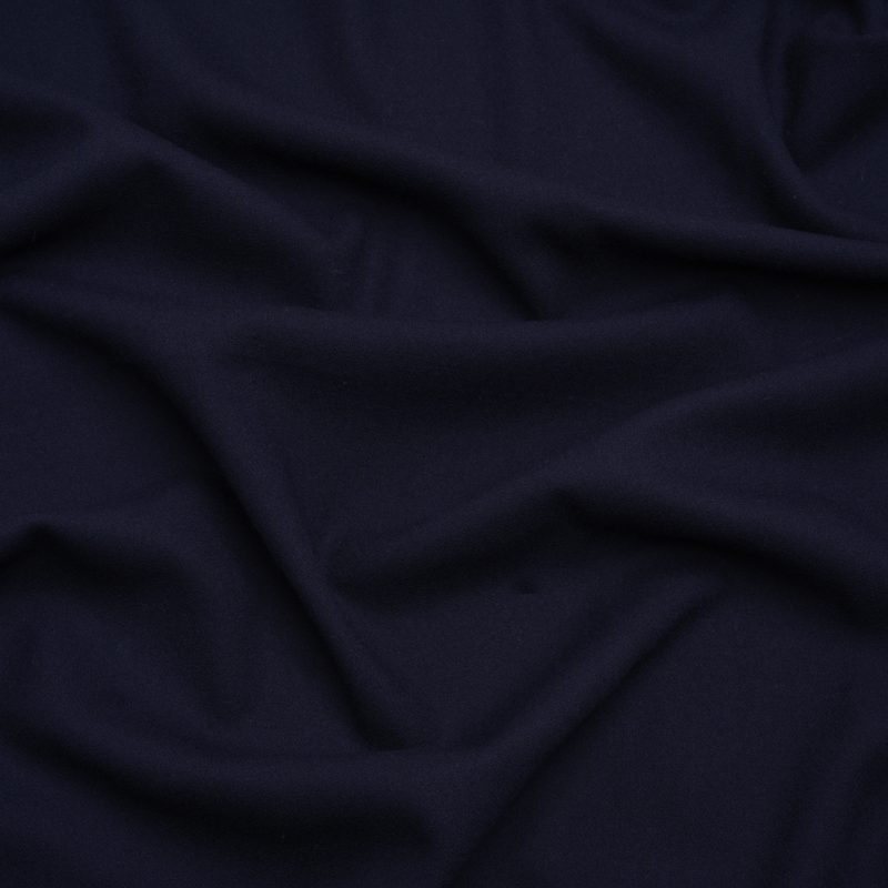 Close up of Single Wool Crepe - Navy - Premium Collection from Mood Fabrics | Navy Single Wool Crepe Fashion Fabric - Premium Collection - Mood Fabrics - PV9100-NAVY - Perfect for Transitional Sewing Patterns