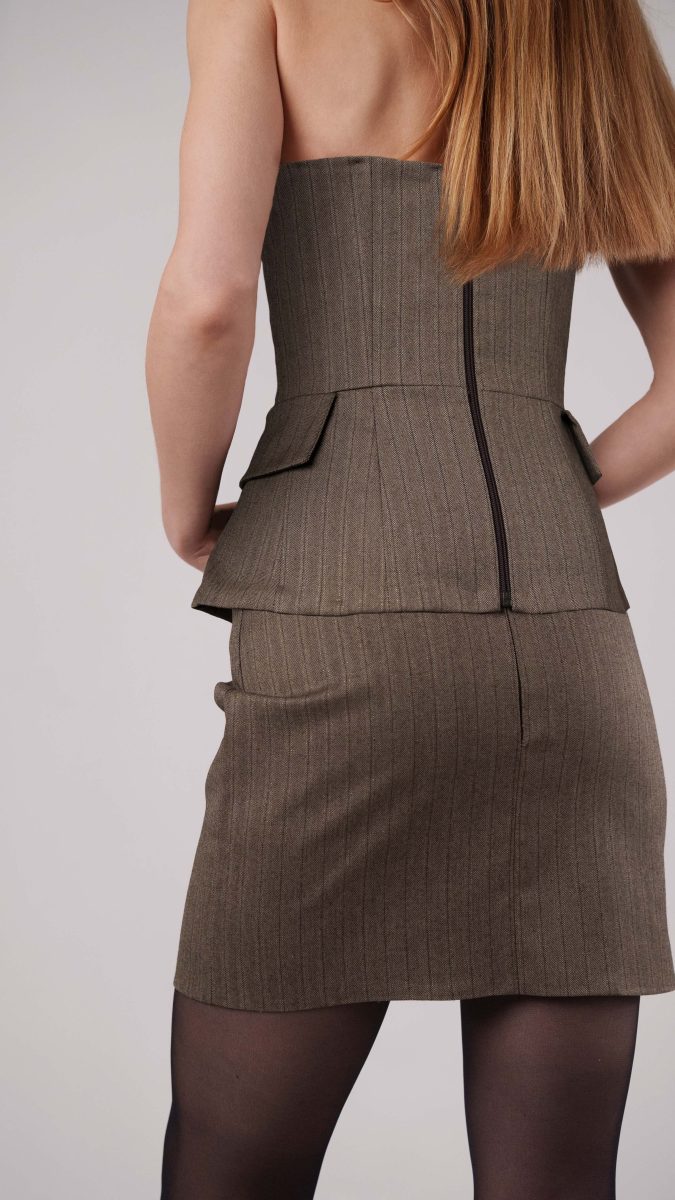 Back view of The Ela Peplum Top & Ava Mini Skirt, free sewing pattern from the Mood Fabrics Sewciety blog, sewn in Brown and Chinchilla Metallic Herringbone Striped Polyester Suiting fabric.