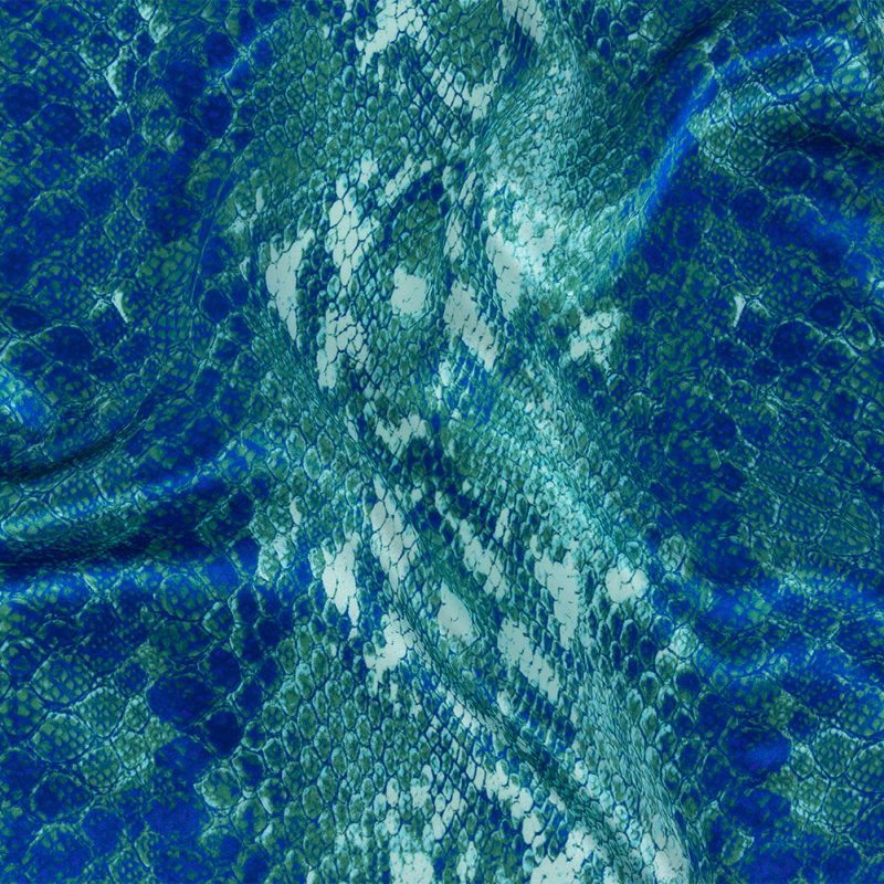 Close up of Mood Exclusive Italian Royal and Jade Python Printed Silk Charmeuse from Mood Fabrics