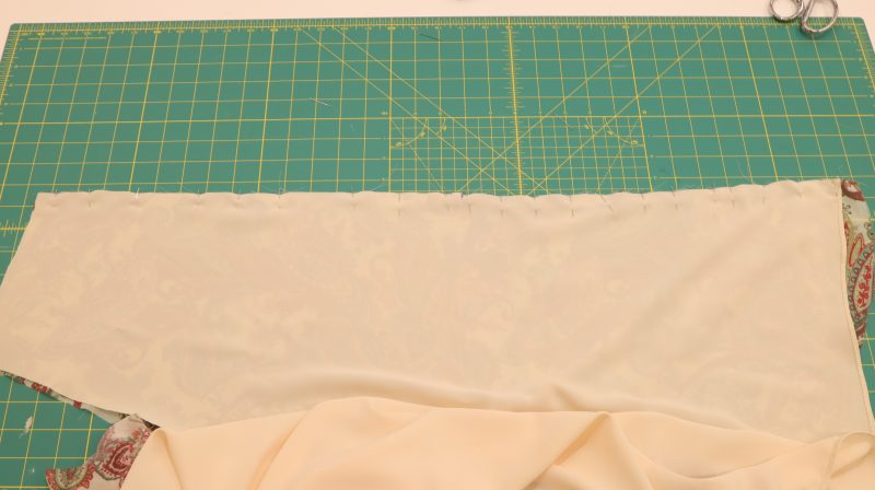 How To Pin-Sew Lining To Main Fabric Front Opening - Italian-Polyester-Georgette - Baratti Blouson Dress - MDF457 - Mood Fabrics Sewciety Blog Pin and sew the lining and main fabric together at the front opening of the dress.