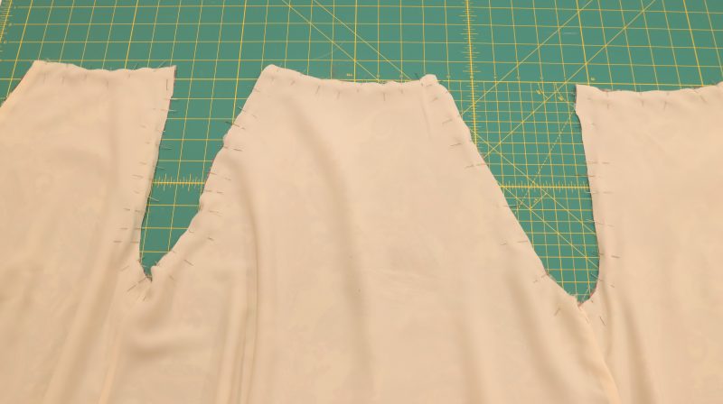 How To Pin-Sew Neckline And Armholes - Italian-Polyester-Georgette - Baratti Blouson Dress - MDF457 - Mood Fabrics Sewciety Blog Pin and sew neckline and armholes of both lining and main fabric.