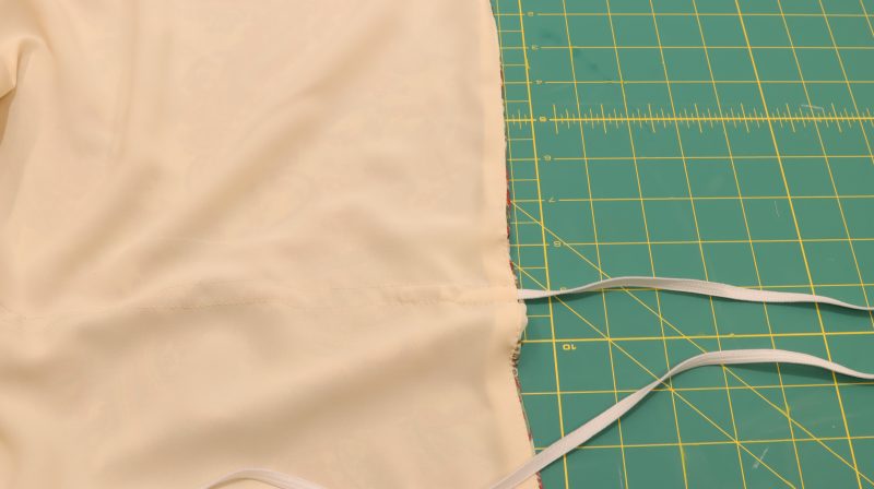 How To Insert Elastic Into Waistband Channel - Elastic-Trimming - Baratti Blouson Dress - MDF457 - Mood Fabrics Sewciety Blog Feed safety pin through tunnel.