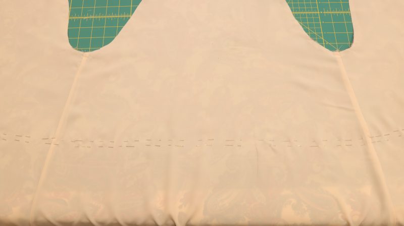 How To Secure Lining To Main Fabric Waistband Channel - Italian-Polyester-Georgette - Baratti Blouson Dress - MDF457 - Mood Fabrics Sewciety Blog Secure fabric with pins before sewing the tunnel.