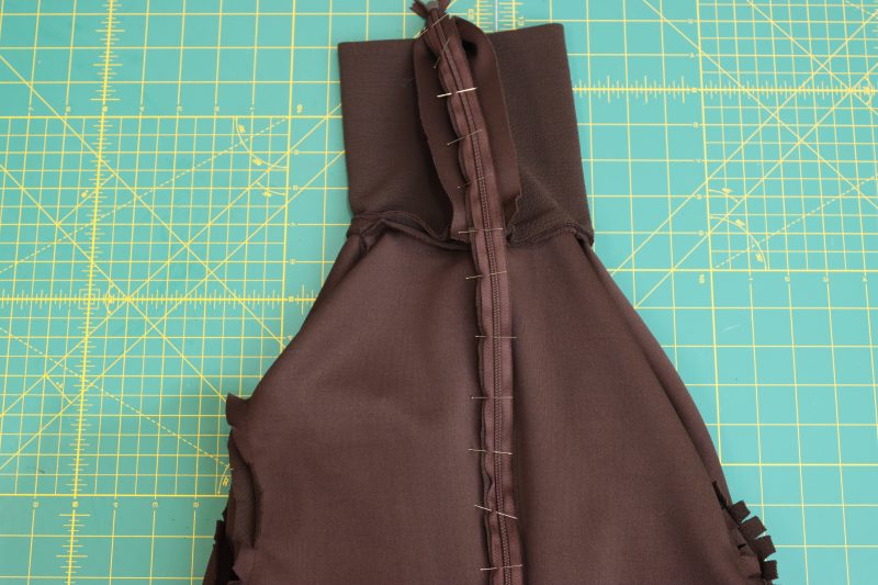 How To Pin Other-Half-Of-Zipper-To-Other-Side-Of-Back-Center-Seam - Invisible Zipper 24" by YKK - 917 Dark Chocolate - Nob Hill Draped Midi Dress - MDF458 - Mood Fabrics Sewciety Blog Pin the other side of the zipper right sides together with the other side of the center back seam of the dress.