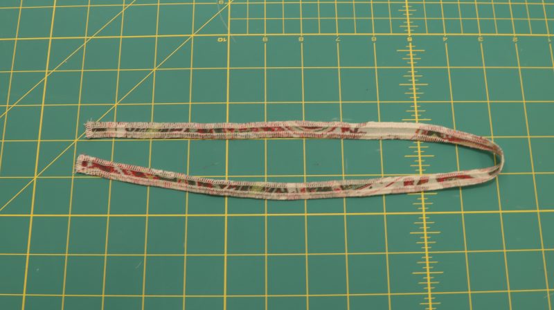 How To Serge Elastic Casing - Italian-Polyester-Georgette - Baratti Blouson Dress - MDF457 - Mood Fabrics Sewciety Blog Serge edges of elastic casing fabric.