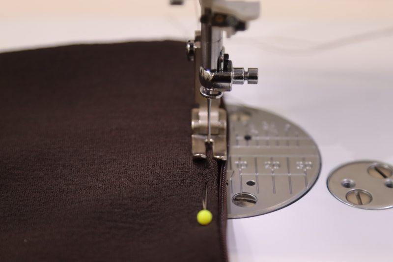 How To Sew Straight-Stitch-Over-Folded-Edge-Of-Collar-And-Zipper - Invisible Zipper 24" by YKK - 917 Dark Chocolate - Nob Hill Draped Midi Dress - MDF458 - Mood Fabrics Sewciety Blog Sew a straight stitch over the folded edge of the collar and the zipper tape.
