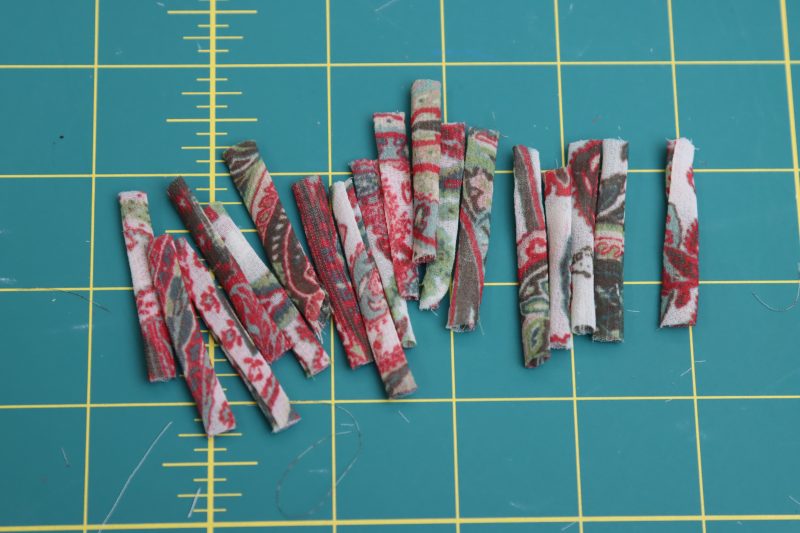 How To Cut Strips For Button Loops - Italian-Polyester-Georgette - Baratti Blouson Dress - MDF457 - Mood Fabrics Sewciety Blog Cut out short strips for button placket.