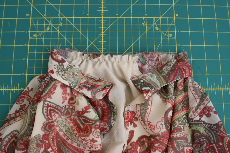 How To Pin-Sew Collar To Neckline - Italian-Polyester-Georgette - Baratti Blouson Dress - MDF457 - Mood Fabrics Sewciety Blog Pin and sew collar to the neckline of the dress.