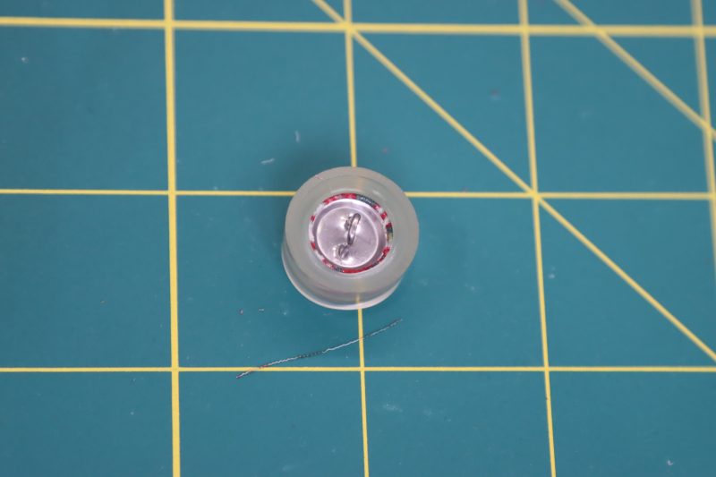 How To Insert Button Backing Into Button Cover - Maxant-Button-Cover-Kit - Baratti Blouson Dress - MDF457 - Mood Fabrics Sewciety Blog Tuck in the fabric and insert the button backing.