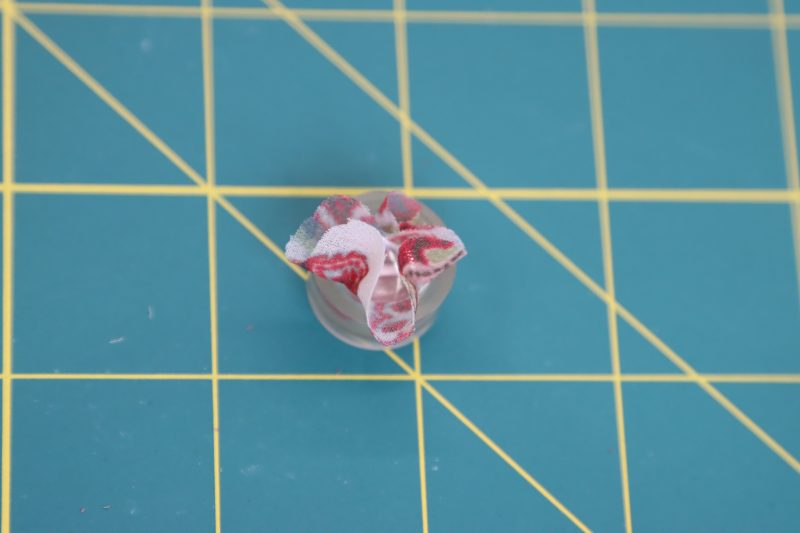 How To Insert Button Cover Into Rubber Holder - Maxant-Button-Cover-Kit - Baratti Blouson Dress - MDF457 - Mood Fabrics Sewciety Blog Push the button cap into the rubber holder over the fabric.