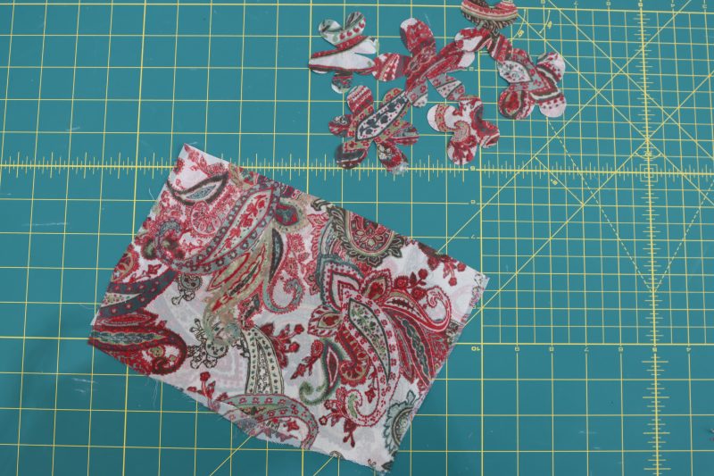 How To Cut Flower Shapes - Double-Fusible-Interfacing - Baratti Blouson Dress - MDF457 - Mood Fabrics Sewciety Blog Freehand cut several flower shapes out of the fused fabric.