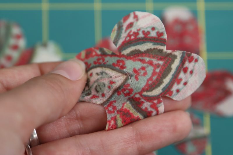 How To Cut Slits Through Centers Of Flowers - Double-Fusible-Interfacing - Baratti Blouson Dress - MDF457 - Mood Fabrics Sewciety Blog Cut a small slit in the center of each flower.