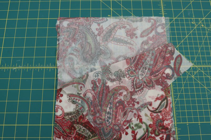 How To Press Double Sided Interfacing Between Main Fabric - Double-Fusible-Interfacing - Baratti Blouson Dress - MDF457 - Mood Fabrics Sewciety Blog Iron the double sided interfacing between two pieces of the main fabric.