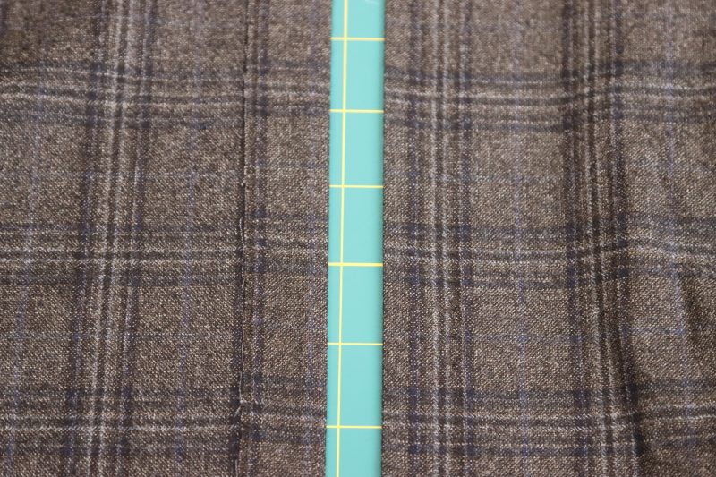 How To Iron Blind Hem Flat - Super 130s Wool Twill Suiting Made in Italy Charcoal Gray Navy Plaid Deadstock - Mood Fabrics - Oxford Pleated Skirt and Tie Free Sewing Pattern Tutorial - MDF460 - Mood Fabrics Sewciety Blog - Iron the blind hem flat.