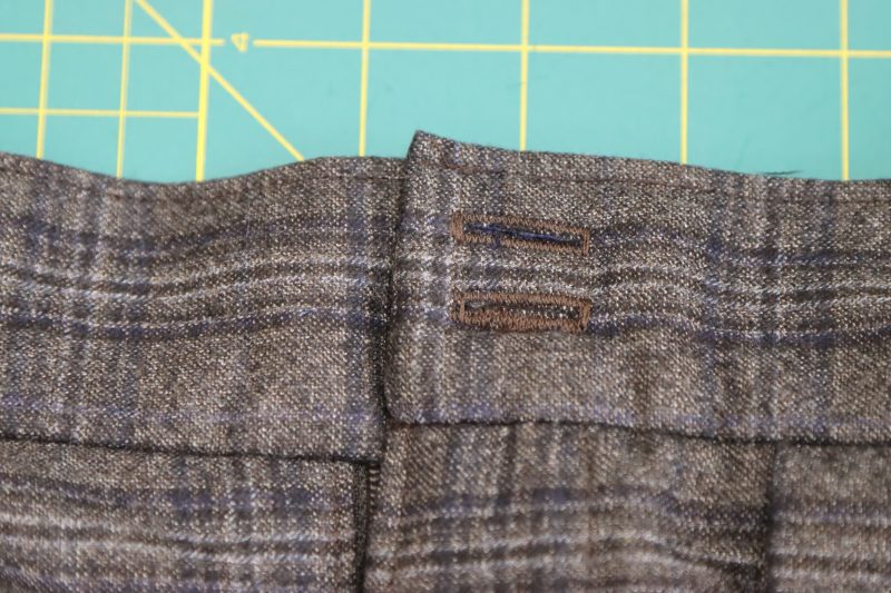 How To Sew Buttonholes With Buttonhole Foot Attachment - Gutermann Sew All Thread 500m 594 Walnut - Mood Fabrics - Oxford Pleated Skirt and Tie Free Sewing Pattern Tutorial - MDF460 - Mood Fabrics Sewciety Blog - Use the buttonhole foot attachment to create two buttonholes in a single column.