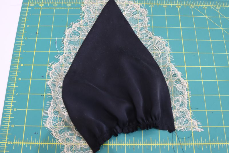 How To Gather Bottom Edge Of Bra Cup - Washed Silk Charmeuse 19mm Black - Mood Fabrics - Odette Nightgown Free Sewing Pattern Tutorial - MDF462 - Mood Fabrics Sewciety Blog - Gather bottom edge of each bra cup.