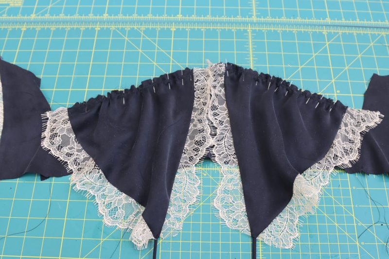 How To Pin Sew Bra Cups To Underbust - Washed Silk Charmeuse 19mm Black - Mood Fabrics - Odette Nightgown Free Sewing Pattern Tutorial - MDF462 - Mood Fabrics Sewciety Blog - Pin and sew the bra cups to the underbust, lining up the notches with the ends of the bra cups.