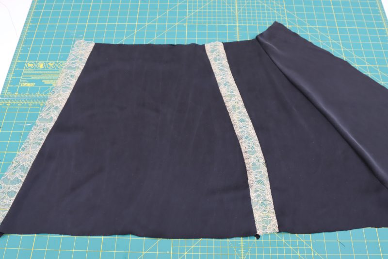 How To Sew Side Panels To Front Panel - Washed Silk Charmeuse 19mm Black - Mood Fabrics - Odette Nightgown Free Sewing Pattern Tutorial - MDF462 - Mood Fabrics Sewciety Blog - Sew a side skirt panel to each piece of lace on the left and right sides of the front skirt panel.