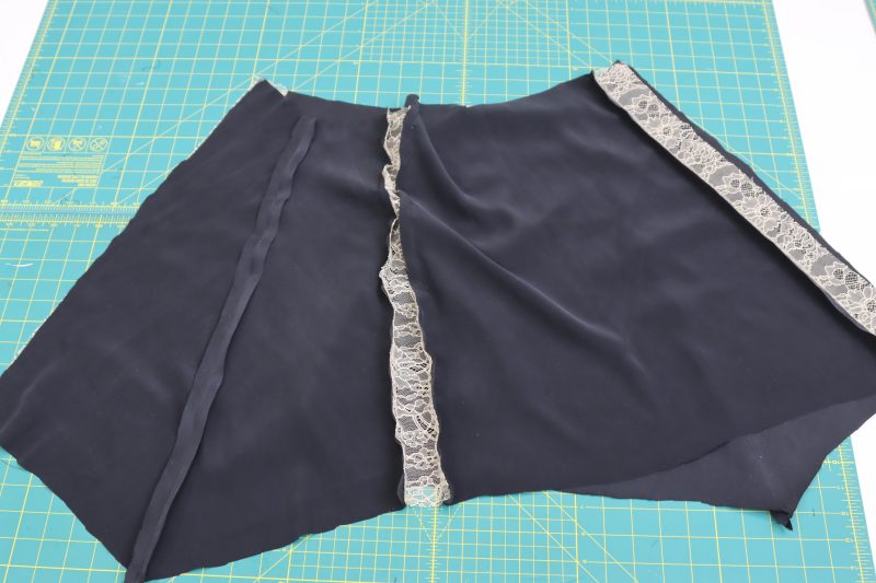 How To Sew Side Panels To Back Panel - Washed Silk Charmeuse 19mm Black - Mood Fabrics - Odette Nightgown Free Sewing Pattern Tutorial - MDF462 - Mood Fabrics Sewciety Blog - Connect the side skirt panels to both the front and back panels to create one big overskirt.