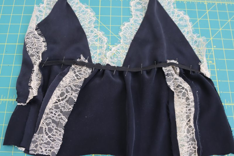 How To Pin Sew Elastic To Top Back Edge - Elastic Trimming - Mood Fabrics - Odette Nightgown Free Sewing Pattern Tutorial - MDF462 - Mood Fabrics Sewciety Blog - Pin and sew the elastic to the top back edge of the underbust.