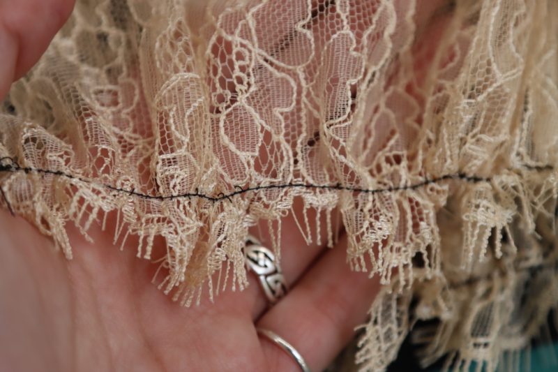 How To Gather Lace Trim For Skirts - Peach Floral Scalloped Re Embroidered Lace with Eyelash Fringe - Mood Fabrics - Odette Nightgown Free Sewing Pattern Tutorial - MDF462 - Mood Fabrics Sewciety Blog - Gather the edge of the lace trim to create a ruffle.