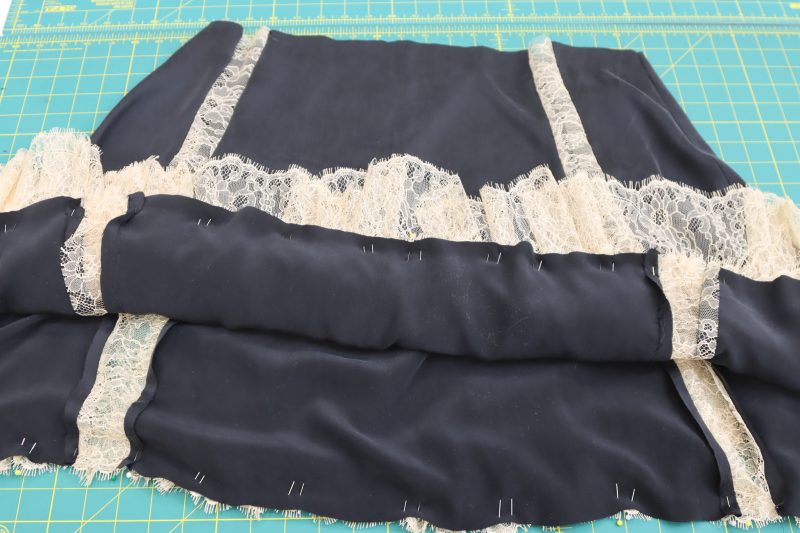 How To Pin Ruffle To Overskirt - Peach Floral Scalloped Re Embroidered Lace with Eyelash Fringe - Mood Fabrics - Odette Nightgown Free Sewing Pattern Tutorial - MDF462 - Mood Fabrics Sewciety Blog - Pin and sew the other ruffle to the bottom edge of the overskirt.