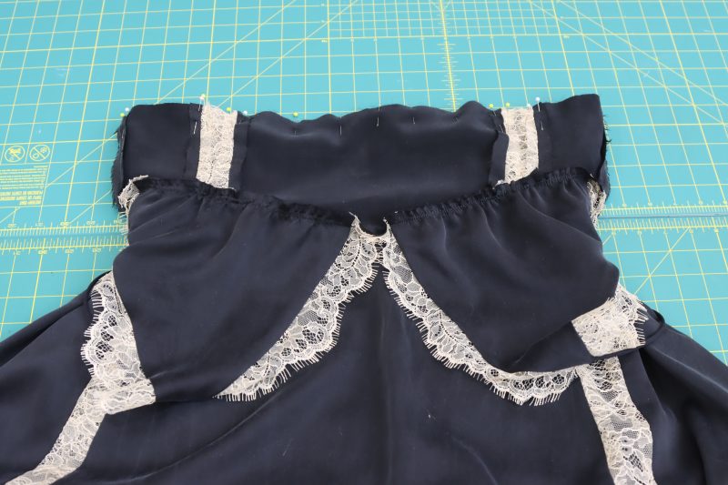 How To Pin Sew Underbust To Waist Opening - Washed Silk Charmeuse 19mm Black - Mood Fabrics - Odette Nightgown Free Sewing Pattern Tutorial - MDF462 - Mood Fabrics Sewciety Blog - Pin and sew the underbust to the waist opening of the skirt, right sides together.
