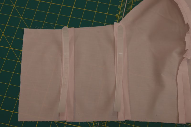 How To Cut Boning To Size - Rigilene - Mood Fabrics - Glinda Gown Free Sewing Pattern Tutorial - MDF463 - Mood Fabrics Sewciety Blog - Cut boning to match the length of each seam minus 1 inch.