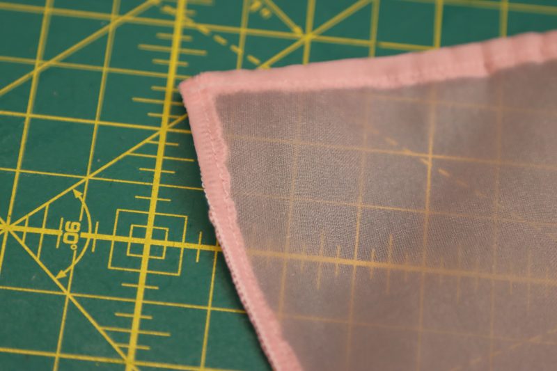 How To Press Folded Hem - Organza - Mood Fabrics - Glinda Gown Free Sewing Pattern Tutorial - MDF463 - Mood Fabrics Sewciety Blog - Press the folded hem flat.