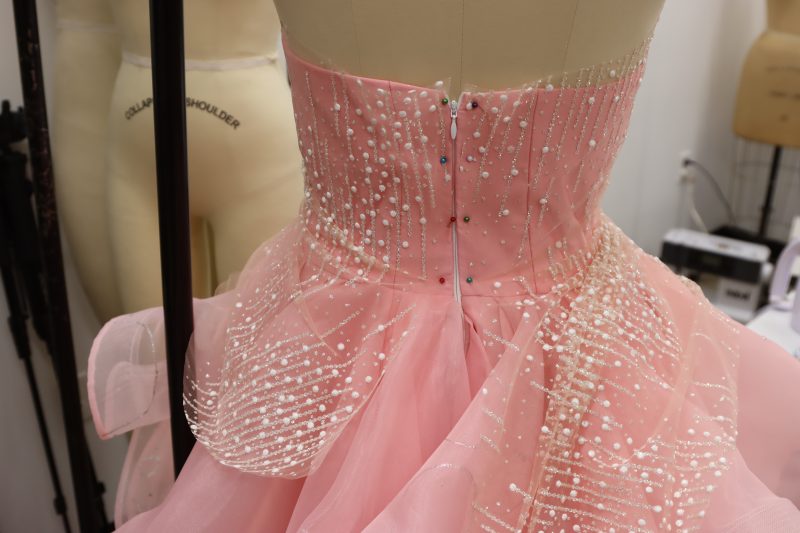 How To Pin Overlay Panels To Back Seam - Organza - Mood Fabrics - Glinda Gown Free Sewing Pattern Tutorial - MDF463 - Mood Fabrics Sewciety Blog - Pin the overlay pieces at the back seam of the dress.