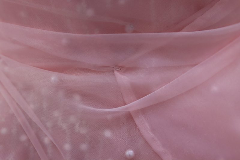 How To Tack Overlay Panels To Bodice - Glitter Tulle - Mood Fabrics - Glinda Gown Free Sewing Pattern Tutorial - MDF463 - Mood Fabrics Sewciety Blog - Create tiny hand tacks all along the organza to attach it securely to the bodice.