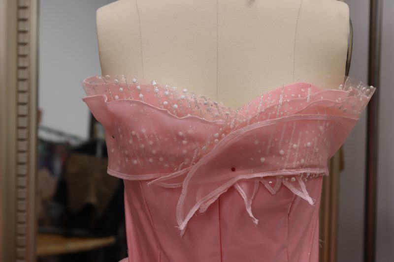 How To Pin Overlay Bust Pieces To Bodice - Glitter Tulle - Mood Fabrics - Glinda Gown Free Sewing Pattern Tutorial - MDF463 - Mood Fabrics Sewciety Blog - Pin the overlay bust panels to the left and right sides of the front of the bust.